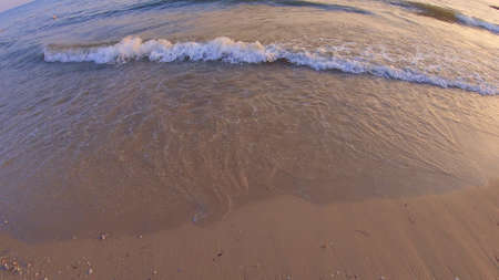 Sea waves crashing on the shore. Wide angle. Seascape, waterscape background.の写真素材