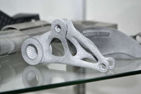 Models printed on 3D printer. Gray objects printed on 3D printer made of plastic close-up. Surface 3D printed models. Prototypes of shapes made by 3d printer. Concept new modern printing technology.の写真素材