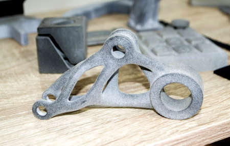 Models printed on 3D printer. Gray objects printed on 3D printer made of plastic close-up. Surface 3D printed models. Prototypes of shapes made by 3d printer. Concept new modern printing technology.の写真素材