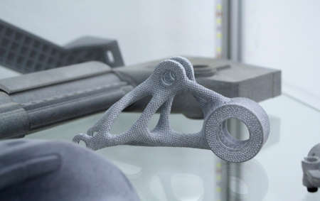 Many different models printed on 3D printer. Gray objects printed on 3D printerの写真素材