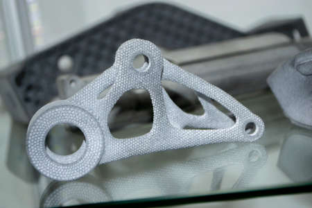 Many different models printed on 3D printer. Gray objects printed on 3D printerの写真素材