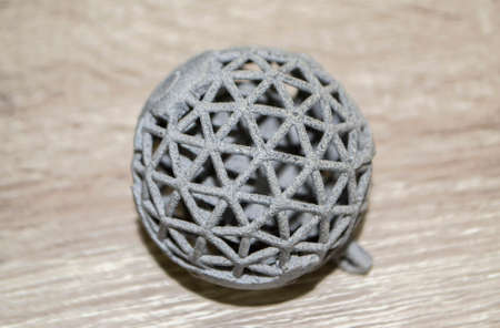 Model printed on 3D printer. Gray object printed on 3D printer made of plasticの写真素材
