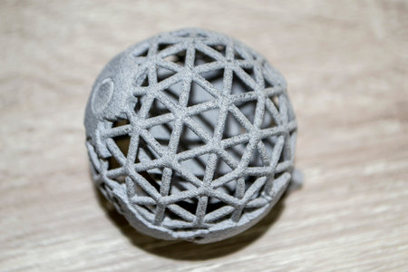 Model printed on 3D printer. Gray object printed on 3D printer made of plasticの写真素材