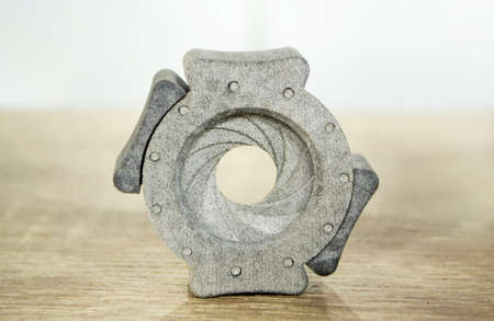 One gray model camera shutter printed on 3D printer. Object printed on 3D printer made of plastic close-up. Isolated of 3D printed model. Prototype of shapes made by 3d printer. Symbol innovativeの写真素材