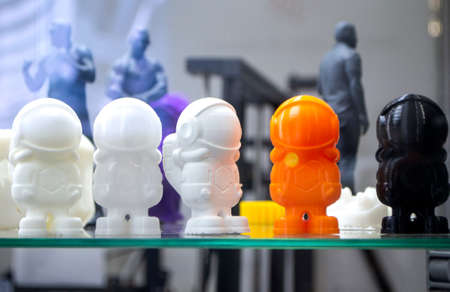Multicolored 3D printed models close-up. Objects printed on 3D printer from plastic close-up. 3D printed forms. Prototypes of various shapes made by 3d printer. Concept new modern printing technologyの写真素材