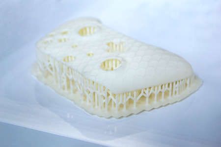Model printed on 3D printer. Object printed on 3D printer made of plastic close-up. Prototype of shape made by 3d printer. 3D printed model. Concept new modern printing technologyの写真素材