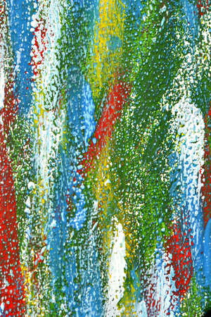 Creative background of colorful brush strokes on canvas closeup. Abstract art background from smeared brush strokes of green red white blue yellow colors macro. Drawing painting paint texture backdropの写真素材