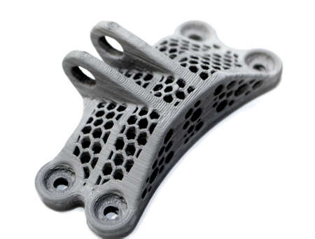 Model printed on a 3d printer made of cement concrete isolated on a white background close-up....