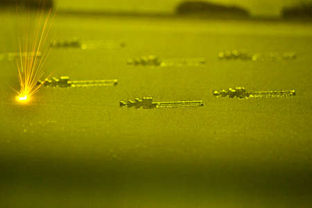 3D printer printing three-dimensional object from metal powder. Selective laser melting. Laser sintering machine for metal. Additive manufacturing metal 3D printer creating 3D model. Metalworkingの写真素材