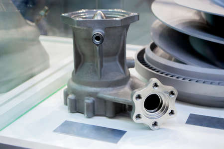 Model object of a large industrial part printed on a 3D printer from metal close-up. New modern...