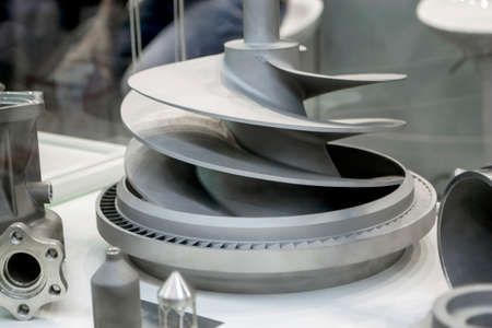 Model object of a large industrial part printed on a 3D printer from metal close-up. New modern progressive additive 3D printing technology. Industry factory plant manufacturing metalwork industrialの写真素材