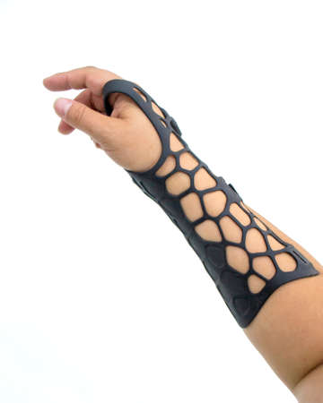 Orthopedic plastic prosthesis printed on powder 3D printer on hand isolated on white background. Gypsum close-up. Multi Jet Fusion MJF 3D printing technology. Modern progressive additive technology.の写真素材