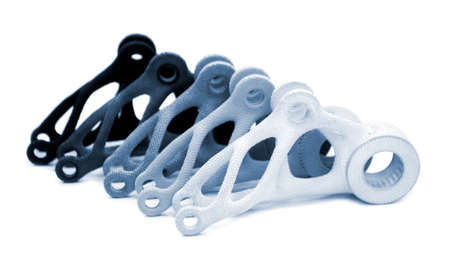 Models printed on 3D printer isolated on white background. Objects details printed on 3D printer from plastic close-up. Prototypes of shapes made by 3d printer. Concept new modern printing technologyの写真素材