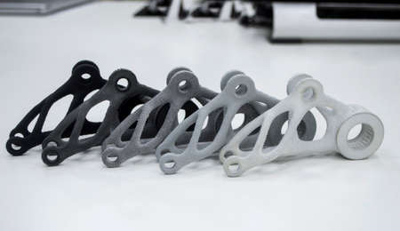 Black white gray models printed on 3D printer in laboratory office. Objects printed on 3D printer from plastic. Prototypes made on 3d printer. Concept new modern printing technology. Multi Jet Fusionの写真素材
