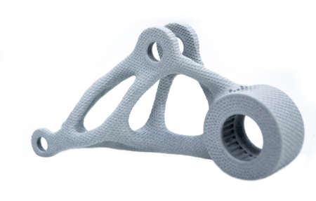 Model printed on 3D printer isolated on white background. Object details printed on 3D printer from plastic close-up. Prototype of shape made by 3d printer. Concept new modern printing technologyの写真素材