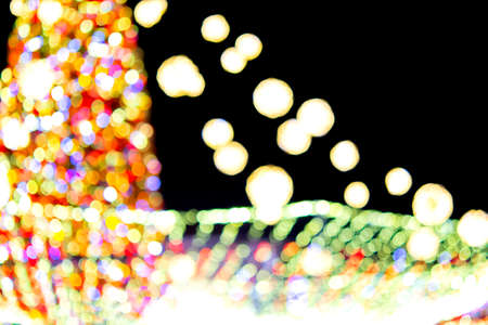 Large New Years Christmas tree decorated with luminous multi-colored garlands and illumination at...