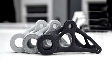 Black white gray models printed on 3D printer in laboratory office. Objects printed on 3D printer...