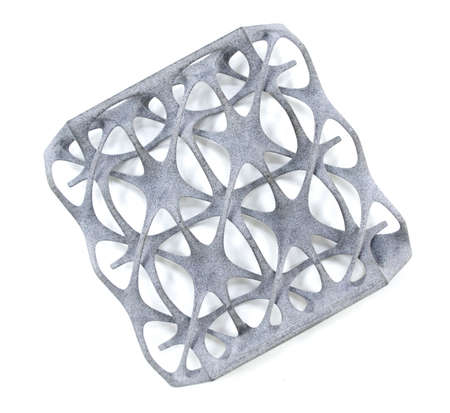 Model printed on 3D printer isolated on white background. Object details printed on 3D printer from plastic close-up. Prototype of shape made by 3d printer. Concept new modern printing technologyの写真素材