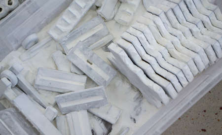 Detail objects printed on powder 3D printer and covered white polyamide powder close-up. Technology Multi Jet Fusion MJF. 3D prototype models created by new additive progressive 3d printing technologyの写真素材