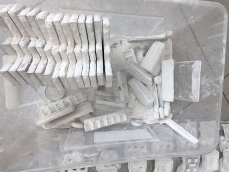 Detail objects printed on powder 3D printer and covered white polyamide powder close-up. Technology Multi Jet Fusion MJF. 3D prototype models created by new additive progressive 3d printing technologyの写真素材