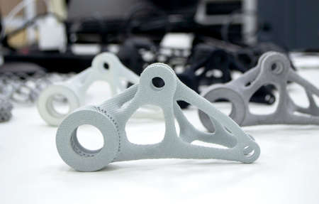 Black white gray models printed on 3D printer in laboratory office. Objects printed on 3D printer from plastic. Prototypes made on 3d printer. Concept new modern printing technology. Multi Jet Fusionの写真素材