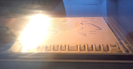 3D printer printing process. High-speed printing of an object on a 3D printer from powder close-up....