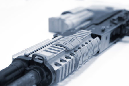 3D printed weapon parts. Assembly of weapons rifle, some parts printed on 3D printer. Details of gray color of weapon printed on 3D printer from polyamide powder. Progressive additive technologyの写真素材