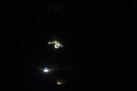 Metal 3D printer printing three-dimensional object from metal powder in dark close-up. Selective laser melting. Laser sintering machine for metal. Additive manufacturing metal 3d printing technology.の写真素材