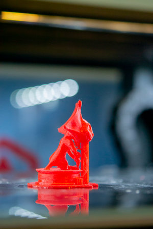 Model printed on a 3D printer from red plastic close-up.