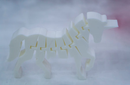 Object printed on 3D printer from plastic. The object a prototype of an toy horse printed on a 3D printer from white plastic. 3D volumetric model. Concept new modern printing technologyの写真素材