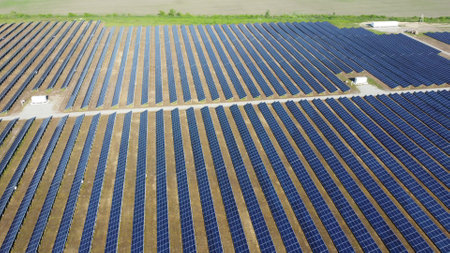 Solar power plant. Many blue panels of a large solar power plant. Aerial drone view. Solar power station. Green clean electricity. New modern technologies. Ecological alternative innovation technologyの写真素材