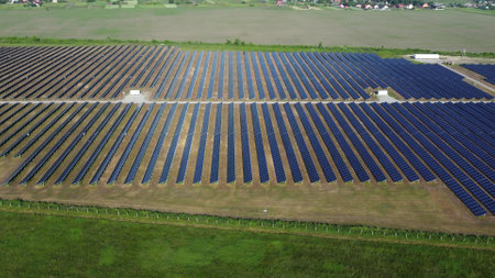 Solar power plant. Many blue panels of a large solar power plant. Aerial drone view. Solar power station. Green clean electricity. New modern technologies. Ecological alternative innovation technologyの写真素材