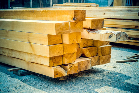Sawmill. Warehouse for sawing boards on a sawmill outdoors. Wood timber stack of wooden blanks construction materialの写真素材