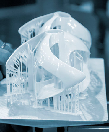Printed models on 3D printer close-up. Objects printed on photopolymer sla 3D printer from liquid photopolymer resins on printing platform. Modern progressive additive technology. 3D printer printingの写真素材