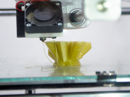 3D printer prints an object. The process of printing model on 3D printer. Model printed on 3D...