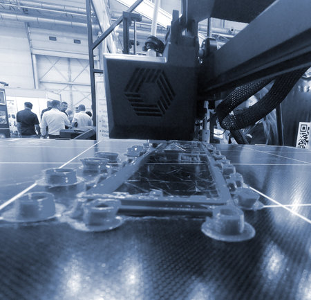 Abstract object printing on 3D printer with molten plastic close-up. 3D printer printing model...