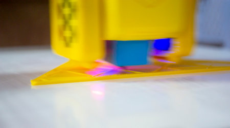 3D printer printing a model. Equipment of a 3D printer during the process of printing a model from...