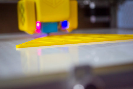 3D printer printing a model. Equipment of a 3D printer during the process of printing a model from...