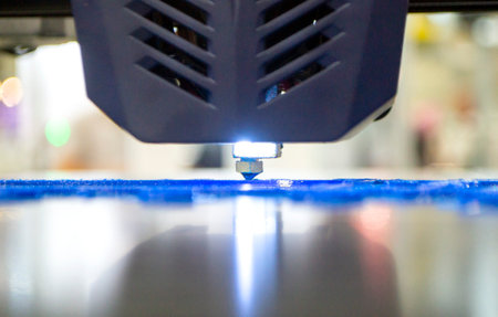 3D printer working close-up. 3D printer prints model from molten plastic close-up. 3D printer...