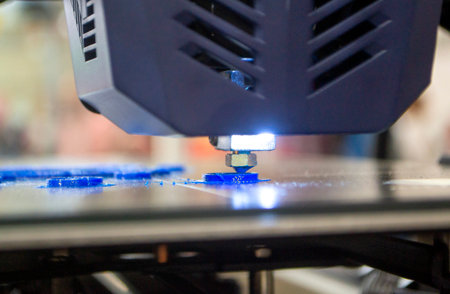 3D printer working close-up. 3D printer prints model from molten plastic close-up. 3D printer...