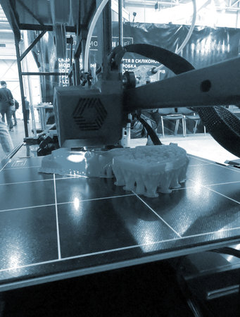 3D printer working close-up. 3D printer prints model from molten plastic close-up. 3D printer...