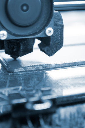 3D printer printing a model. Equipment of a 3D printer during the process of printing a model from...