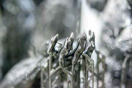 Model of hand printed on a 3D printer from black rubber, close-up. Part of an object created on a 3D...