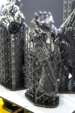 Model of hand printed on a 3D printer from black rubber, close-up. Part of an object created on a 3D...