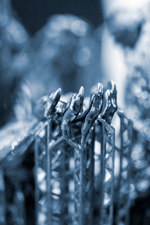 Model of hand printed on a 3D printer from black rubber, close-up. Part of an object created on a 3D...