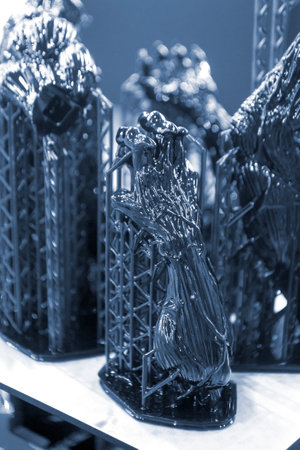 Model of hand printed on a 3D printer from black rubber, close-up. Part of an object created on a 3D printer from hardened rubber under the influence of ultraviolet light. SLA 3D printing technology.の写真素材