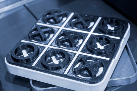 Art object toy Tic Tac Toe printed on 3D printer from white and black plastic. Model created on 3d...