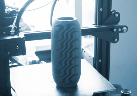 Art object blue vase printed on 3D printer. Abstract model vase created on 3d printer and standing...