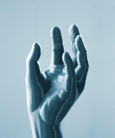 Three-dimensional object printed on 3D printer. Abstract interior model human hand with fingers created on 3d printer. Concept FDM 3D Printing technologies. Additive modern new progressive technologyの写真素材