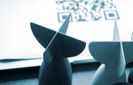 Prototype model of rocket bomb tip printed on 3D printer. Small models of tail fins, tail cone printed on 3D printer from molten plastic on table. New modern innovation printing technologyの写真素材